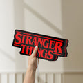 Unlit Stranger Things Logo The Upside Down LED lightbox held by hand to show size and details