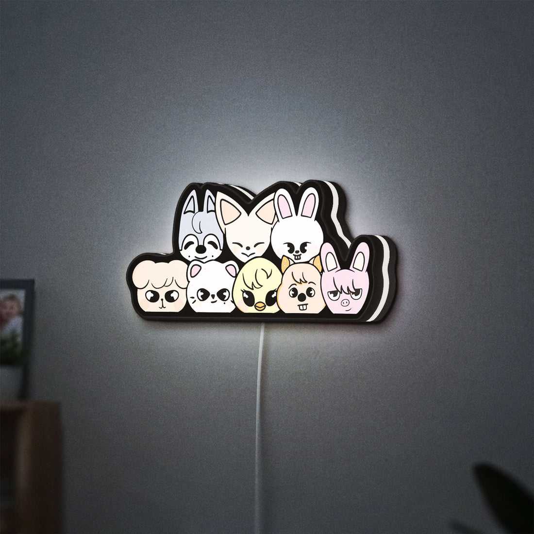 Stray Kids SKZOO K-Pop Mascot LED lightbox hanging on a wall with white glow