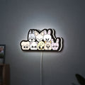 Stray Kids SKZOO K-Pop Mascot LED lightbox hanging on a wall with white glow