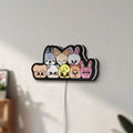 Unlit Stray Kids SKZOO K-Pop Mascot LED lightbox mounted on a wall in daylight