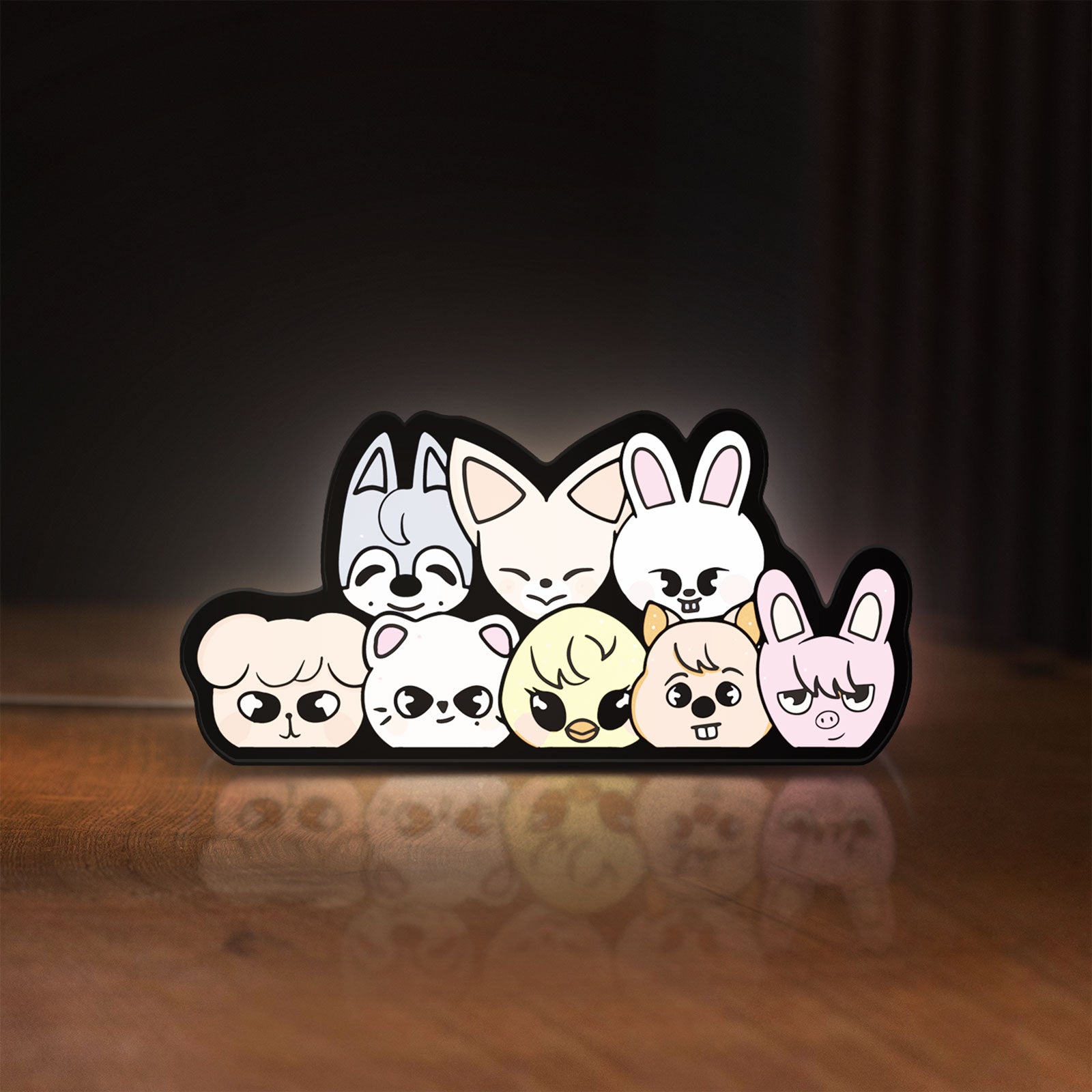 Front view of Stray Kids SKZOO K-Pop Mascot LED lightbox sign glowing on a wooden desk