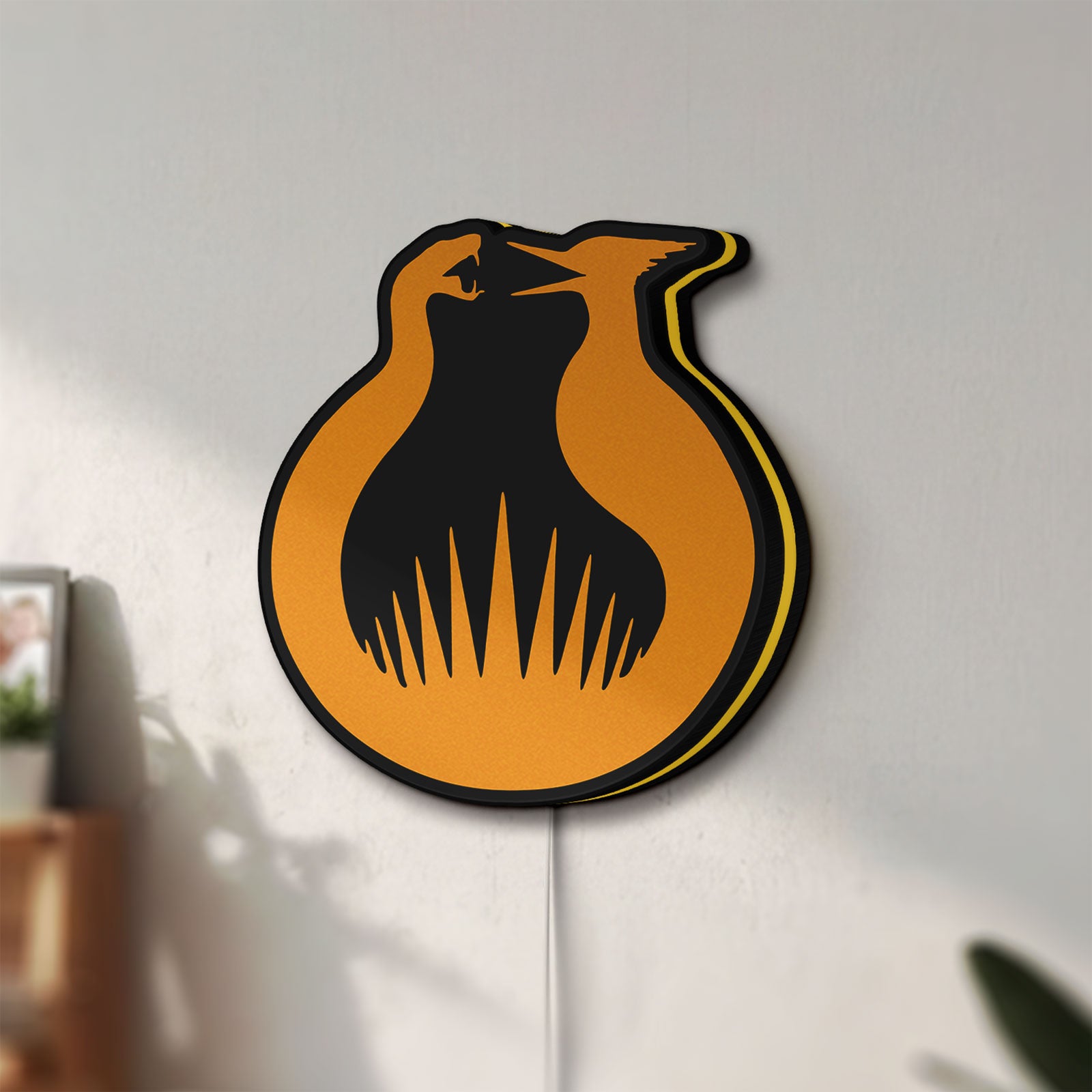 Unlit Hunger Games Sunrise on the Reaping LED lightbox mounted on a wall in daylight