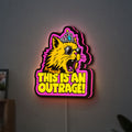 This is an Outrage Meme Funny Quote LED lightbox hanging on a wall with pink glow
