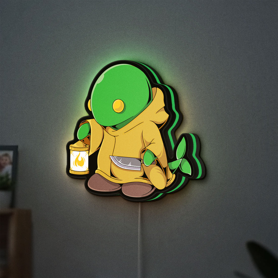 Final Fantasy Tonberry RPG Monster LED lightbox hanging on a wall with green glow