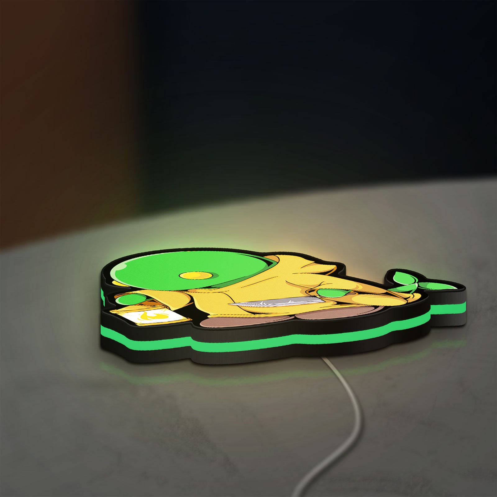 Final Fantasy Tonberry RPG Monster LED lightbox lying flat on a desk with green glow