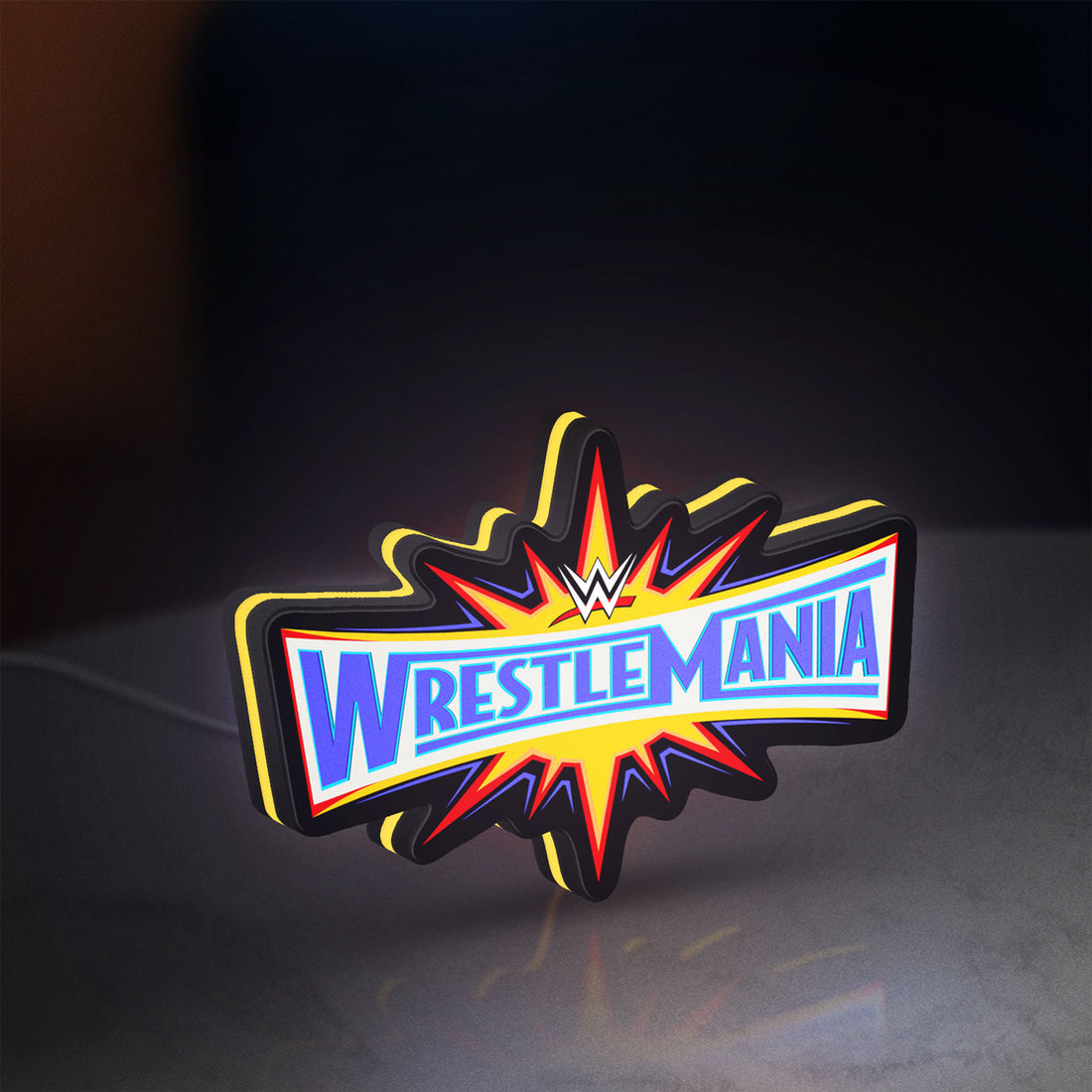 WWE WrestleMania Pro Wrestling LED lightbox hanging on a wall with yellow glow