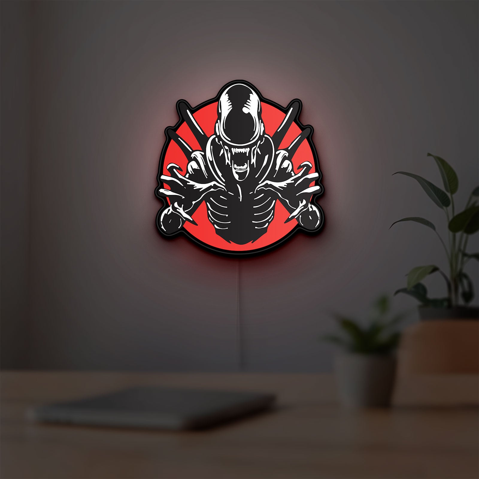 Alien Xenomorph Sci-Fi Horror Movie LED lightbox hanging on a room wall with soft red light