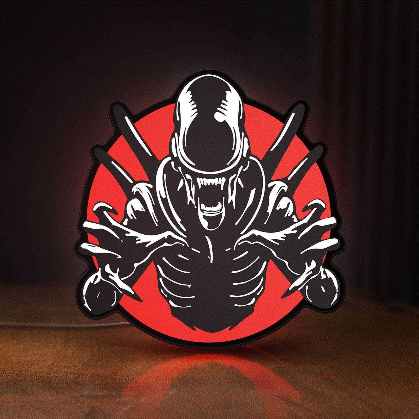 Front view of Alien Xenomorph Sci-Fi Horror Movie LED lightbox sign glowing on a wooden desk