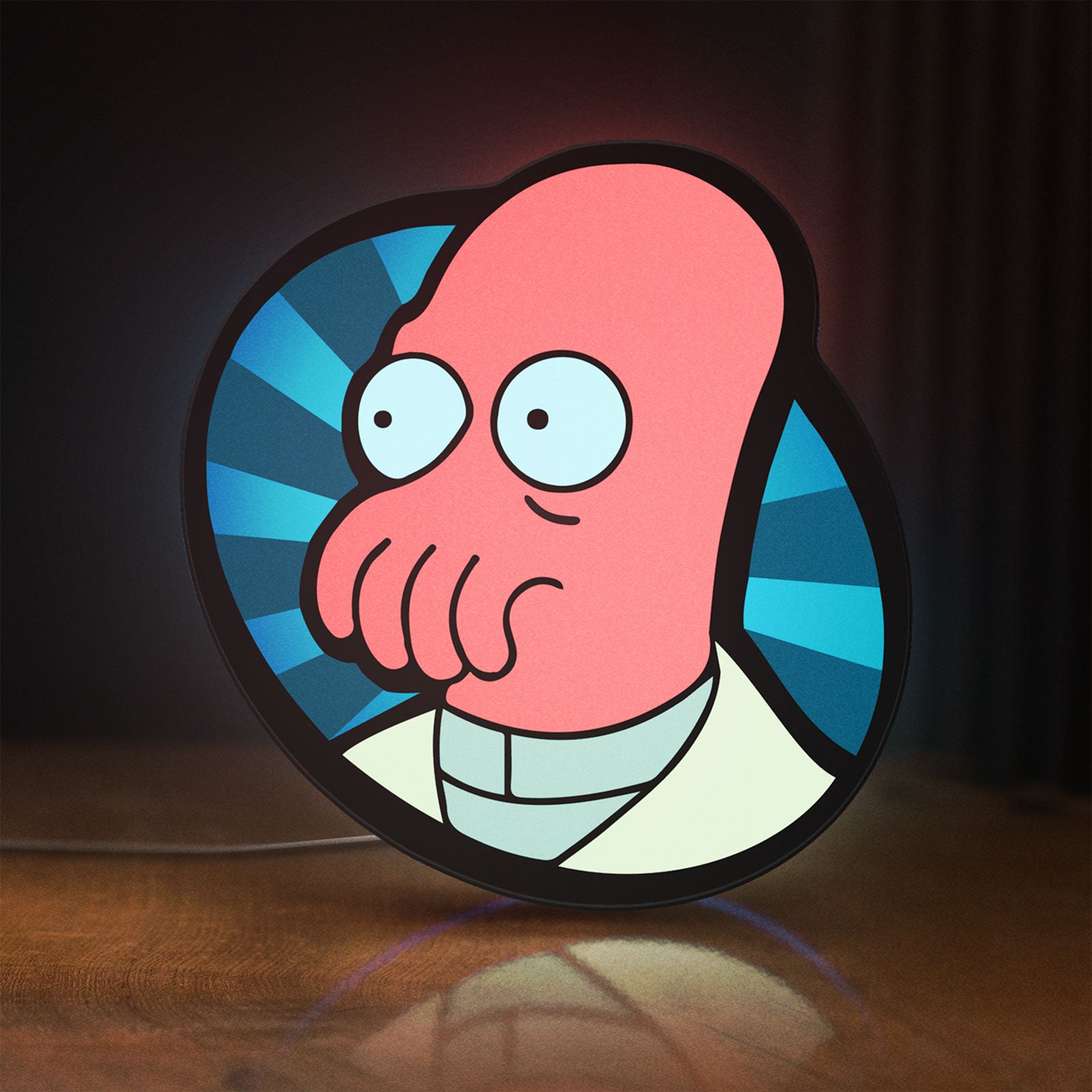 Front view of Futurama Doctor Zoidberg Comedy LED lightbox sign glowing on a wooden desk