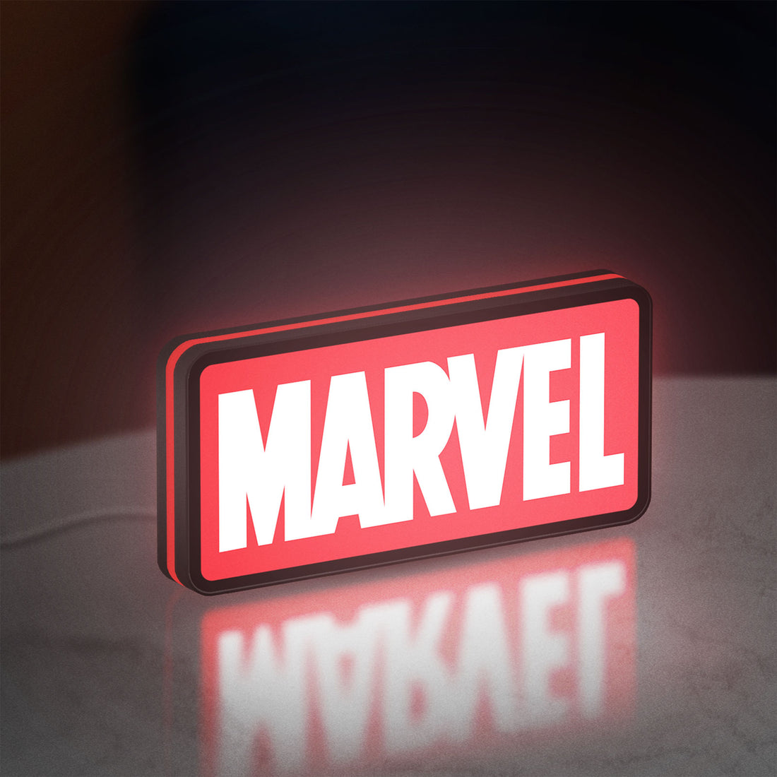 Marvel Comics LED lightbox hanging on a wall with red glow