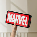 Unlit Marvel Comics LED lightbox held by hand to show size and details