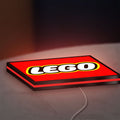 Lego Inspired LED lightbox lying flat on a desk with red glow