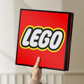 Unlit Lego Inspired LED lightbox held by hand to show size and details