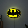 Batman LED lightbox hanging on a wall with yellow glow