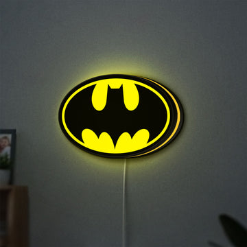 Batman LED lightbox hanging on a wall with yellow glow