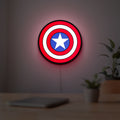 Captain America LED lightbox hanging on a room wall with soft red light