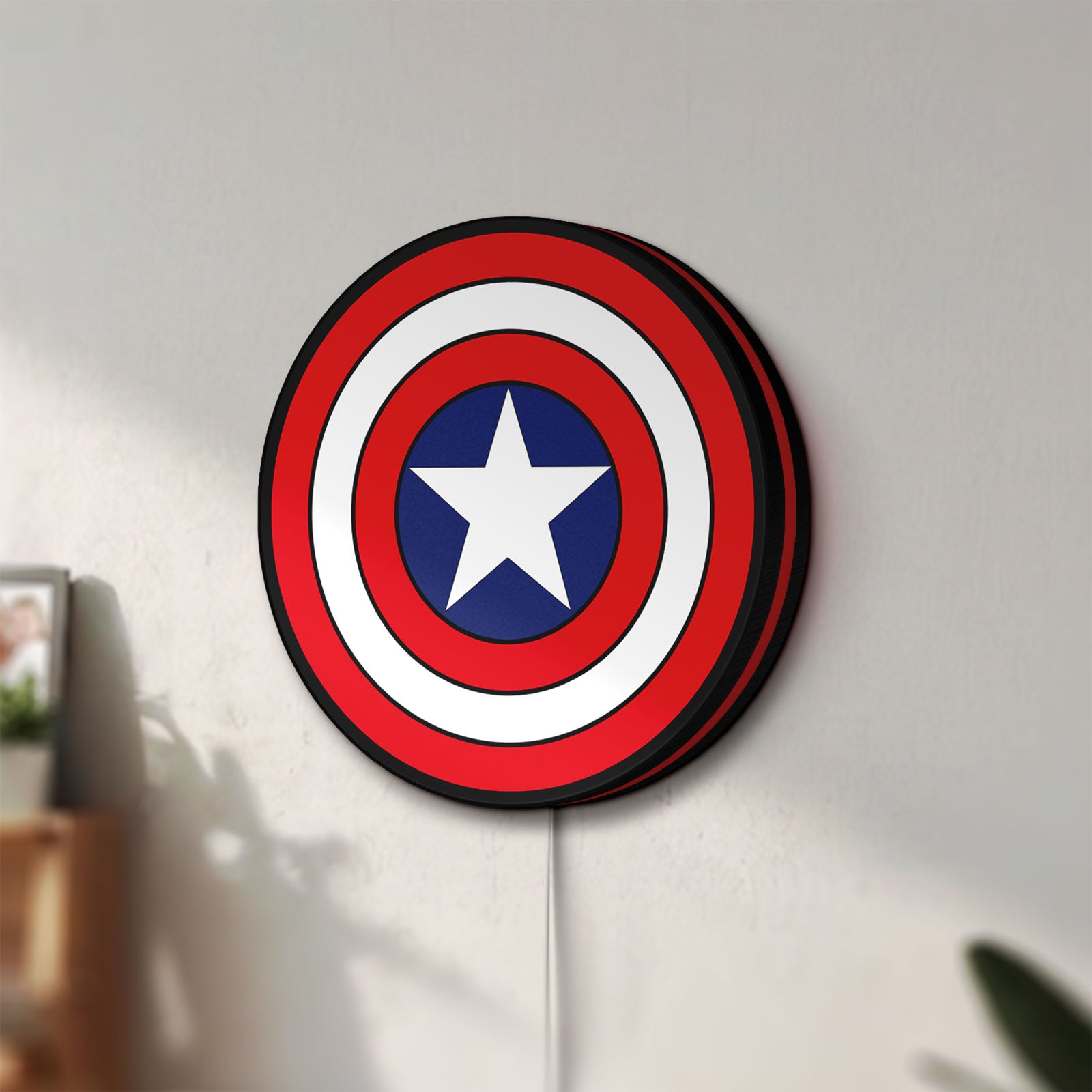 Unlit Captain America LED lightbox mounted on a wall in daylight