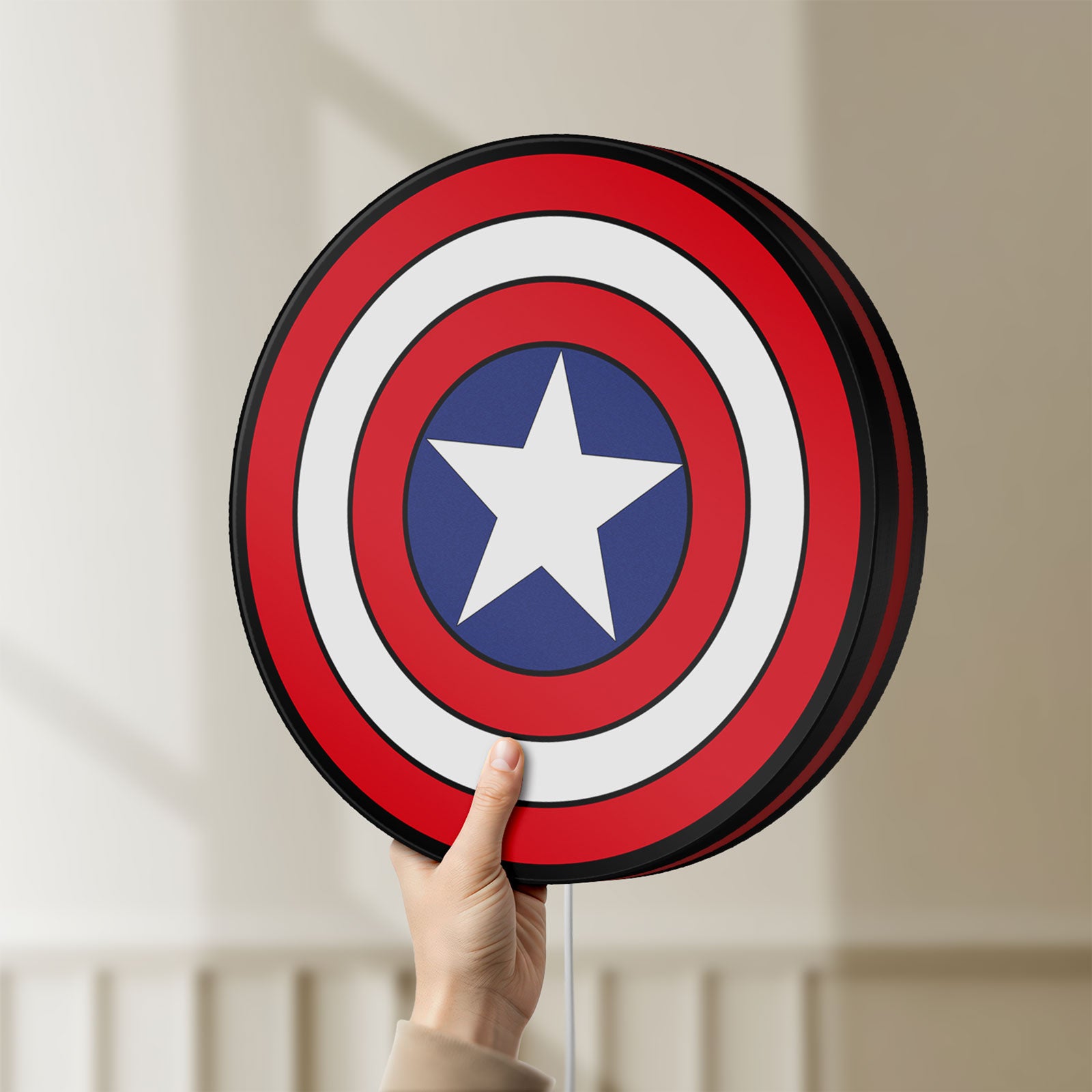 Unlit Captain America LED lightbox held by hand to show size and details