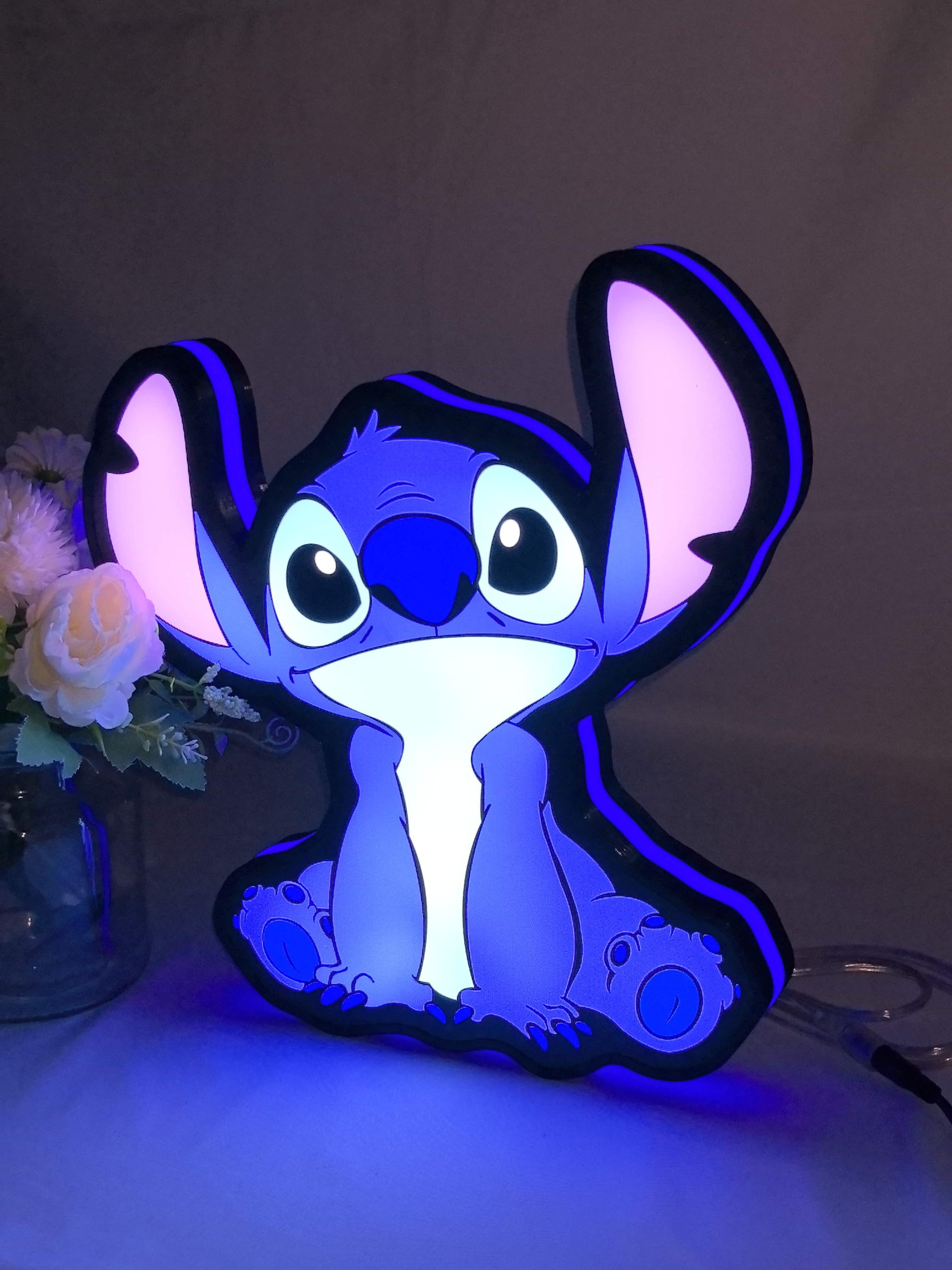 Illuminated angled view standing of Disney Stitch Illuminated Sign in 30cm, great for home theater and media room decor