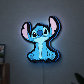 Disney Stitch LED lightbox hanging on a wall with blue glow