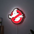 Ghostbusters LED lightbox hanging on a wall with red glow