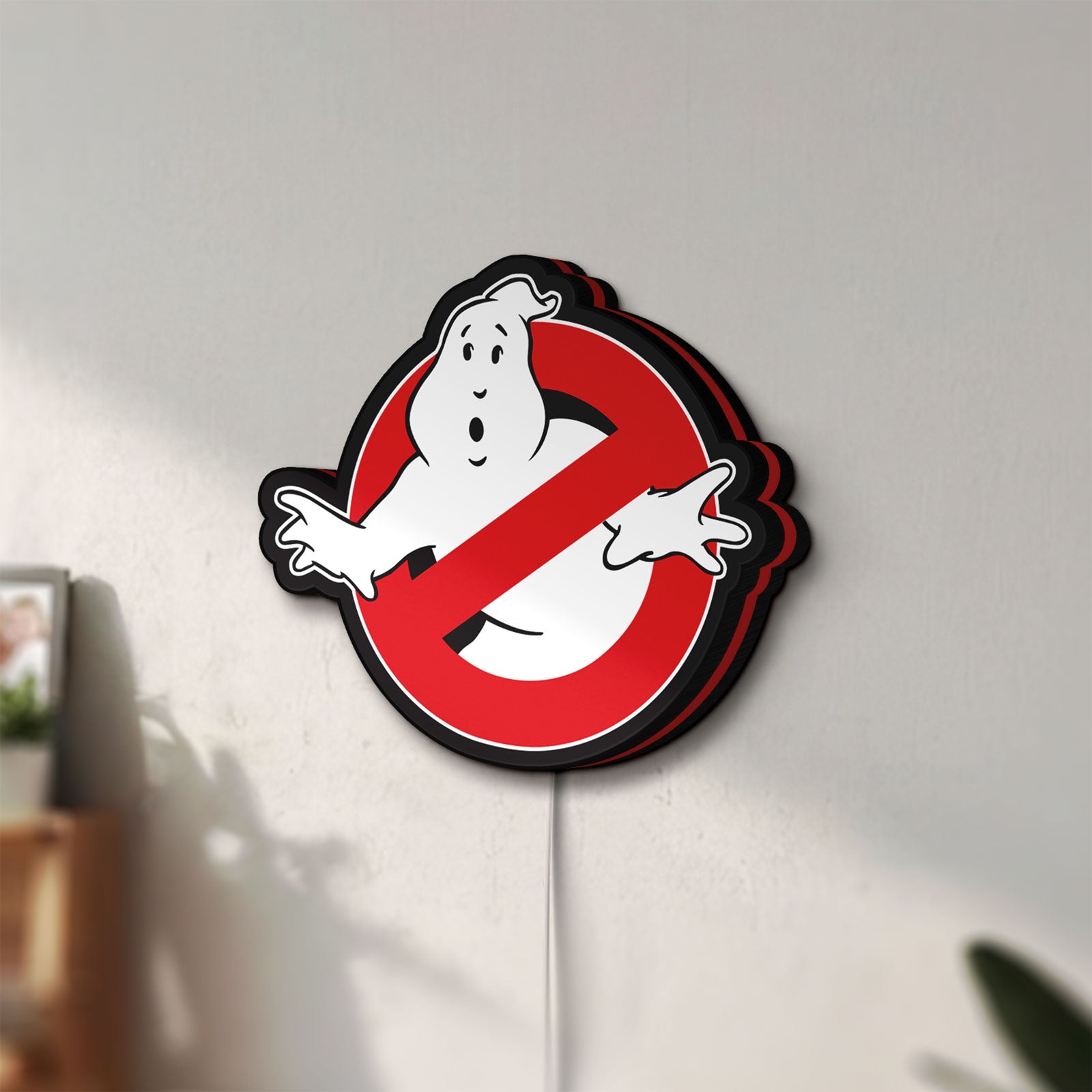 Unlit Ghostbusters LED lightbox mounted on a wall in daylight