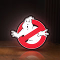 Front view of Ghostbusters LED lightbox sign glowing on a wooden desk