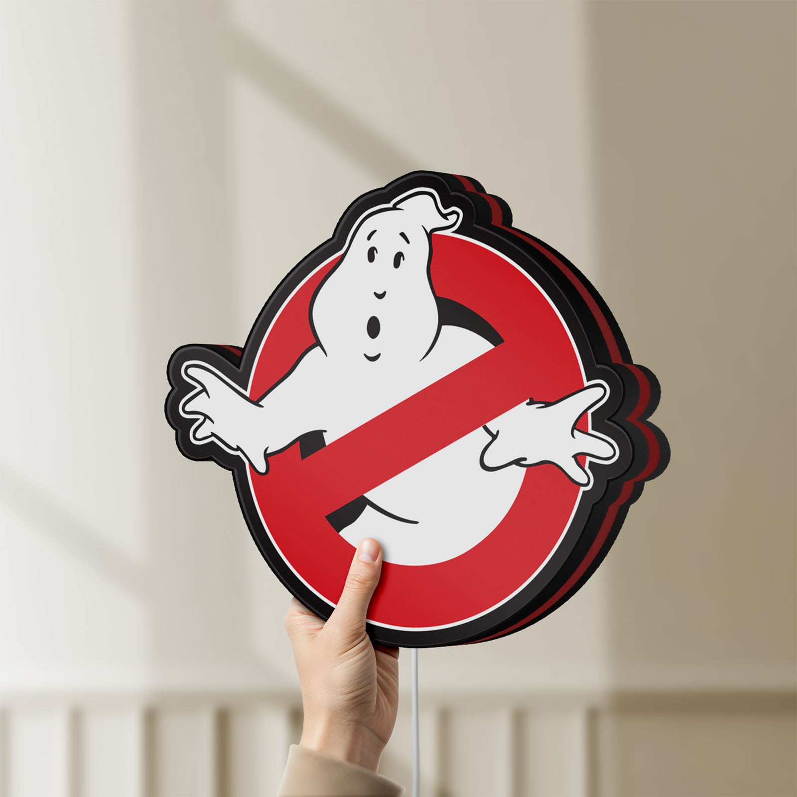 Unlit Ghostbusters LED lightbox held by hand to show size and details