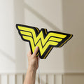 Unlit WONDER WOMAN LED lightbox held by hand to show size and details
