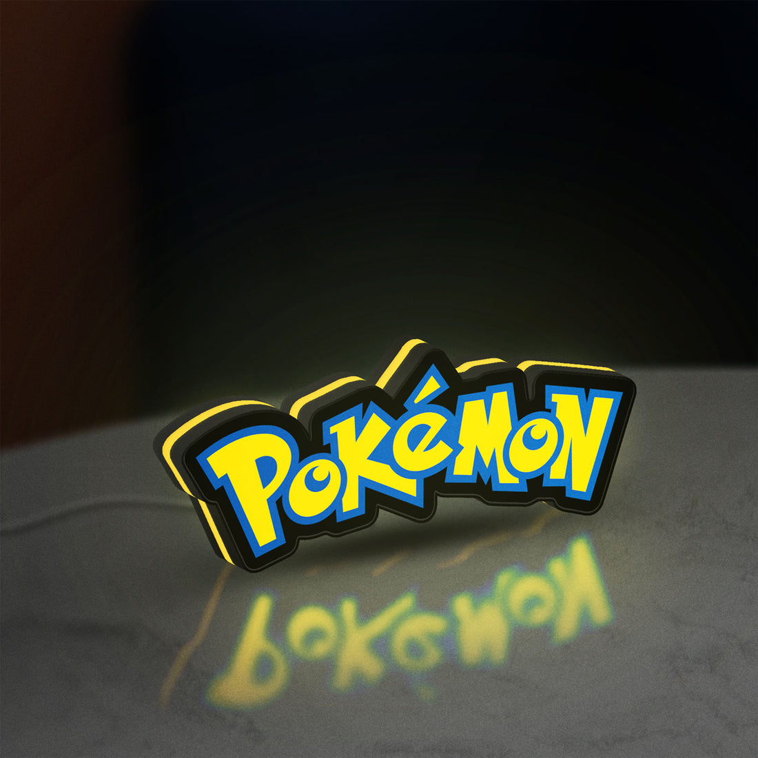 Pokemon LED lightbox hanging on a wall with yellow glow