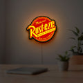 Rusteze LED lightbox hanging on a room wall with soft yellow light