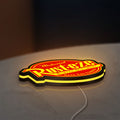 Rusteze LED lightbox lying flat on a desk with yellow glow