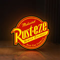 Front view of Rusteze LED lightbox sign glowing on a wooden desk