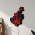 Unlit Spider-Man LED lightbox mounted on a wall in daylight