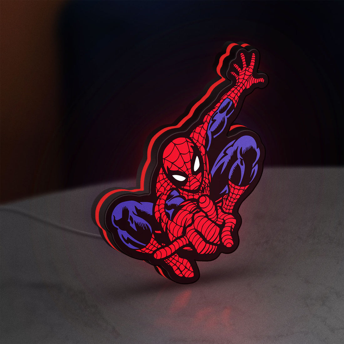 Spider-Man LED lightbox hanging on a wall with red glow