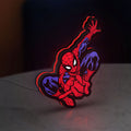 Spider-Man LED lightbox standing on a desk from an angled side view with red glow