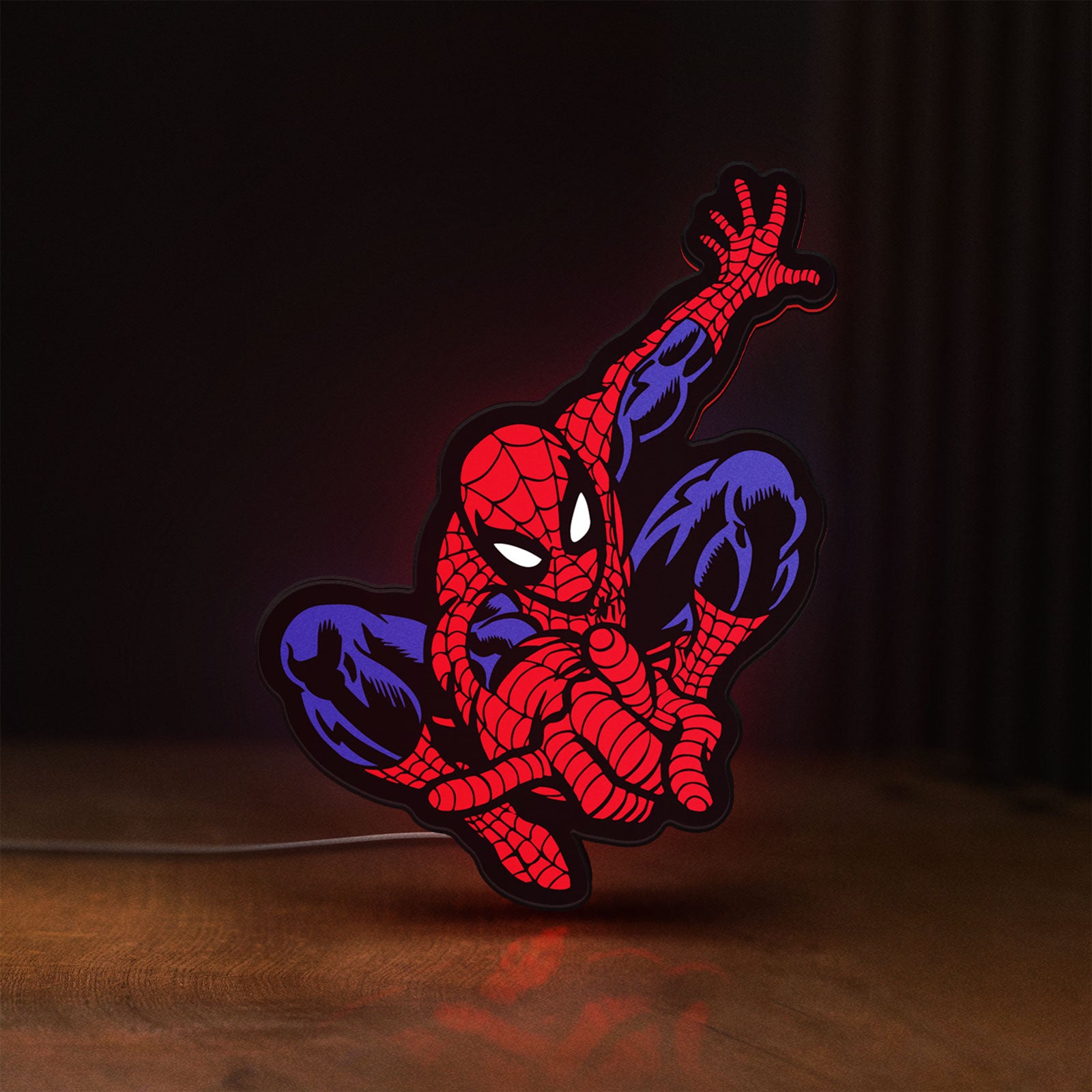 Front view of Spider-Man LED lightbox sign glowing on a wooden desk