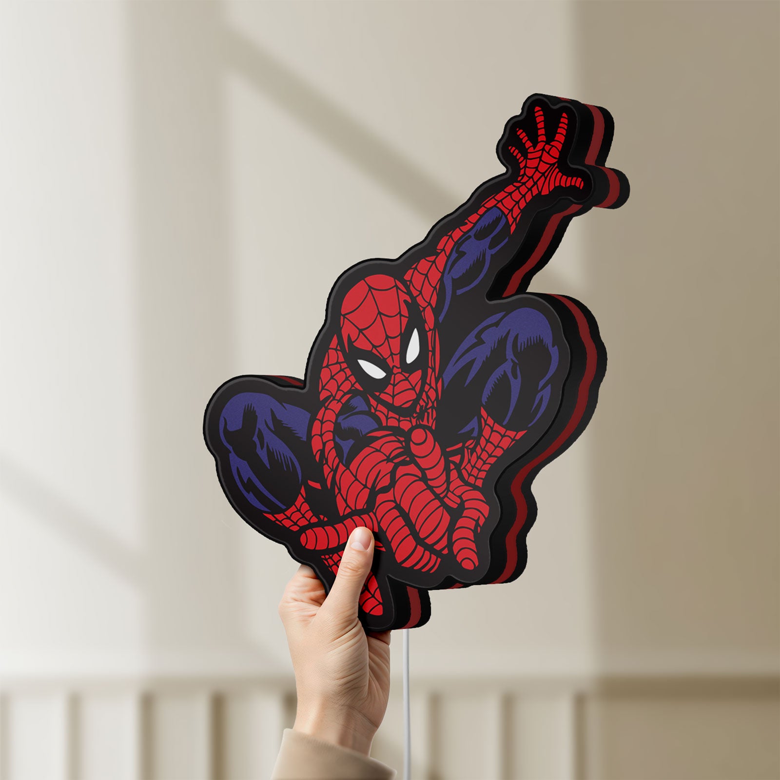 Unlit Spider-Man LED lightbox held by hand to show size and details