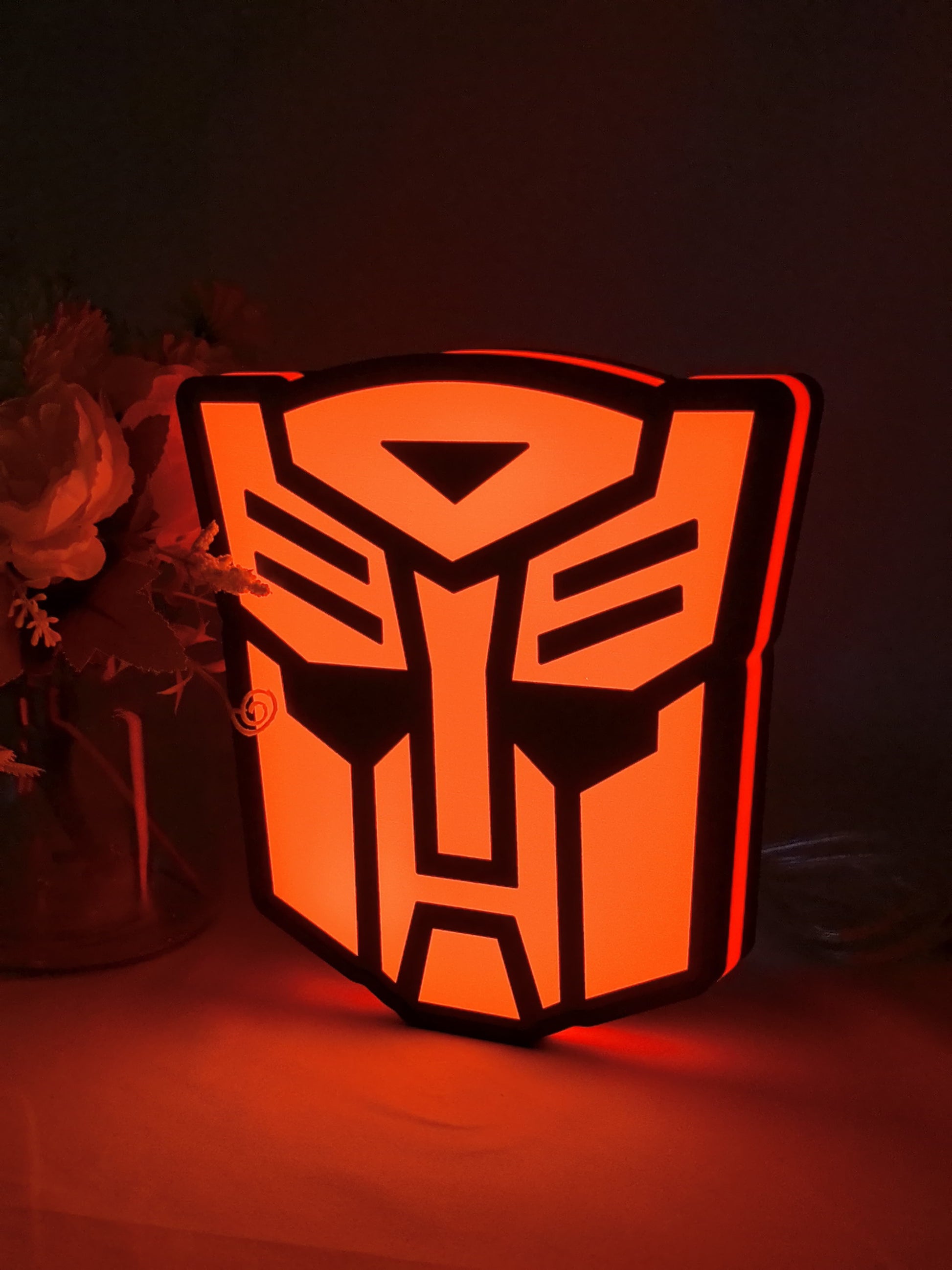 Illuminated angled view standing of Autobot Illuminated Sign in 20cm, perfect for garage and man cave decor