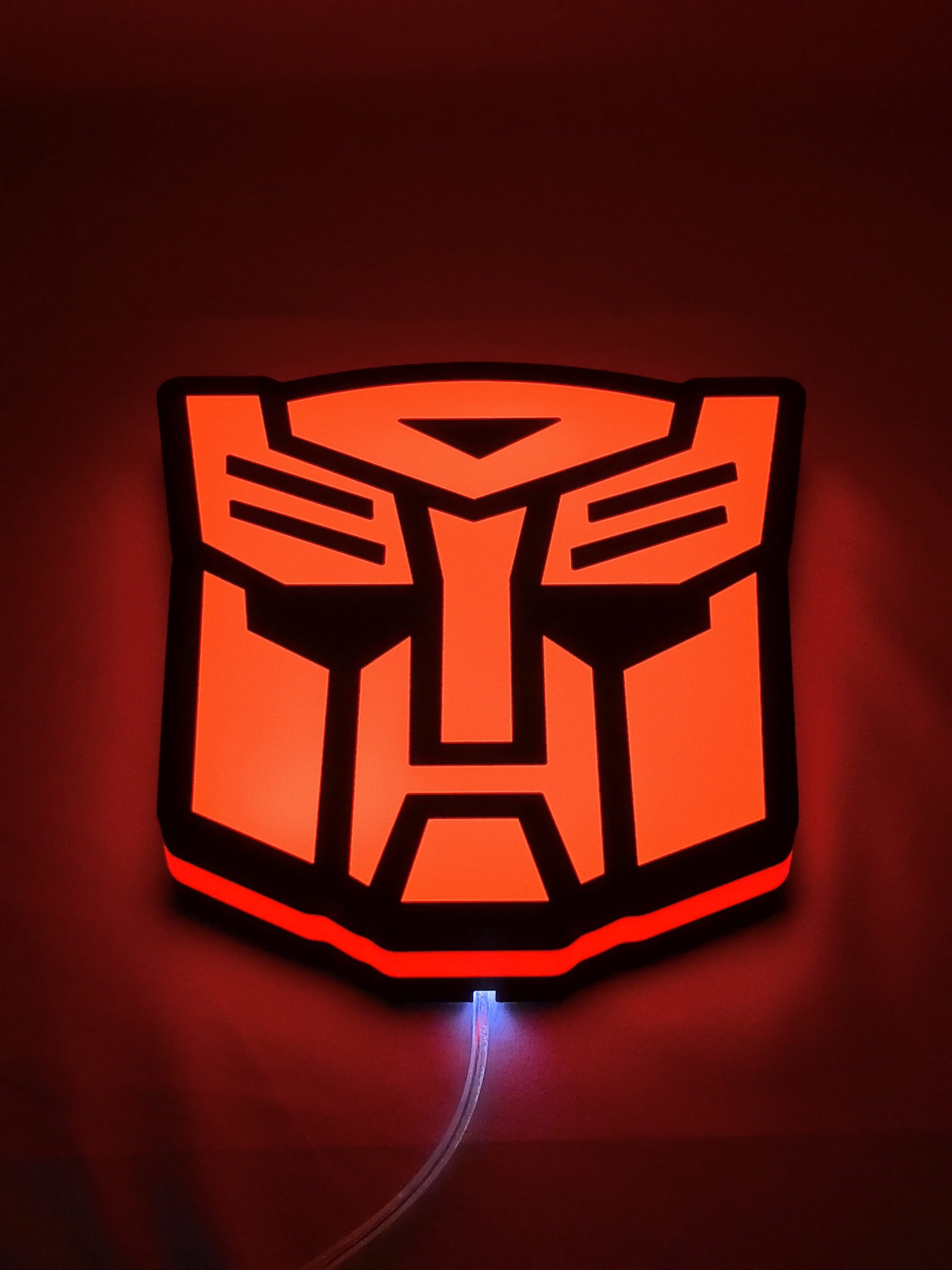 Autobot LED Light Box (20cm) - Illuminated flat lay angled view, perfect for garage and man cave decor