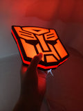 20cm Autobot Glowing Wall Art - Illuminated handheld size reference, perfect for garage and man cave decor