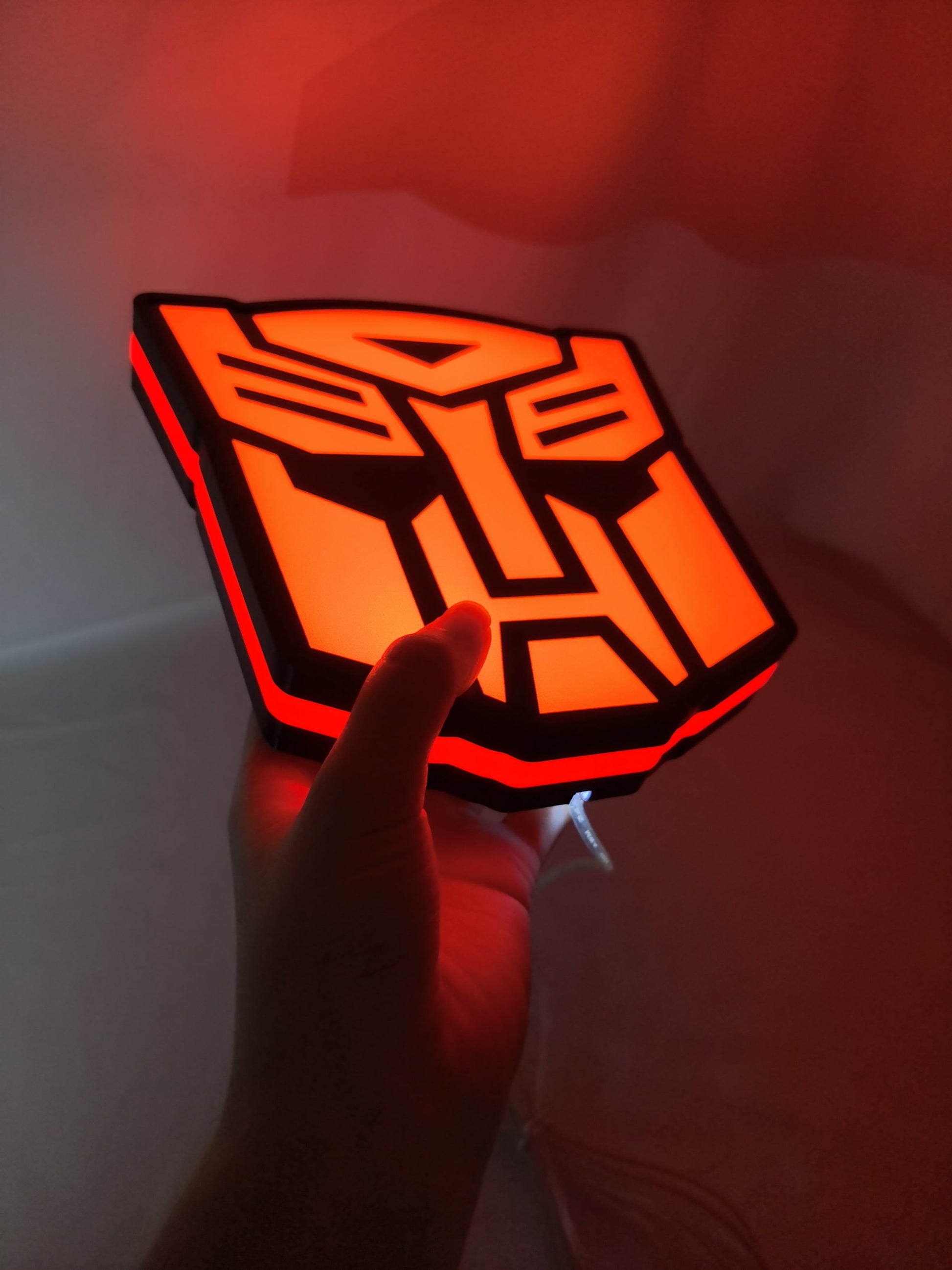 20cm Autobot Glowing Wall Art - Illuminated handheld size reference, perfect for garage and man cave decor