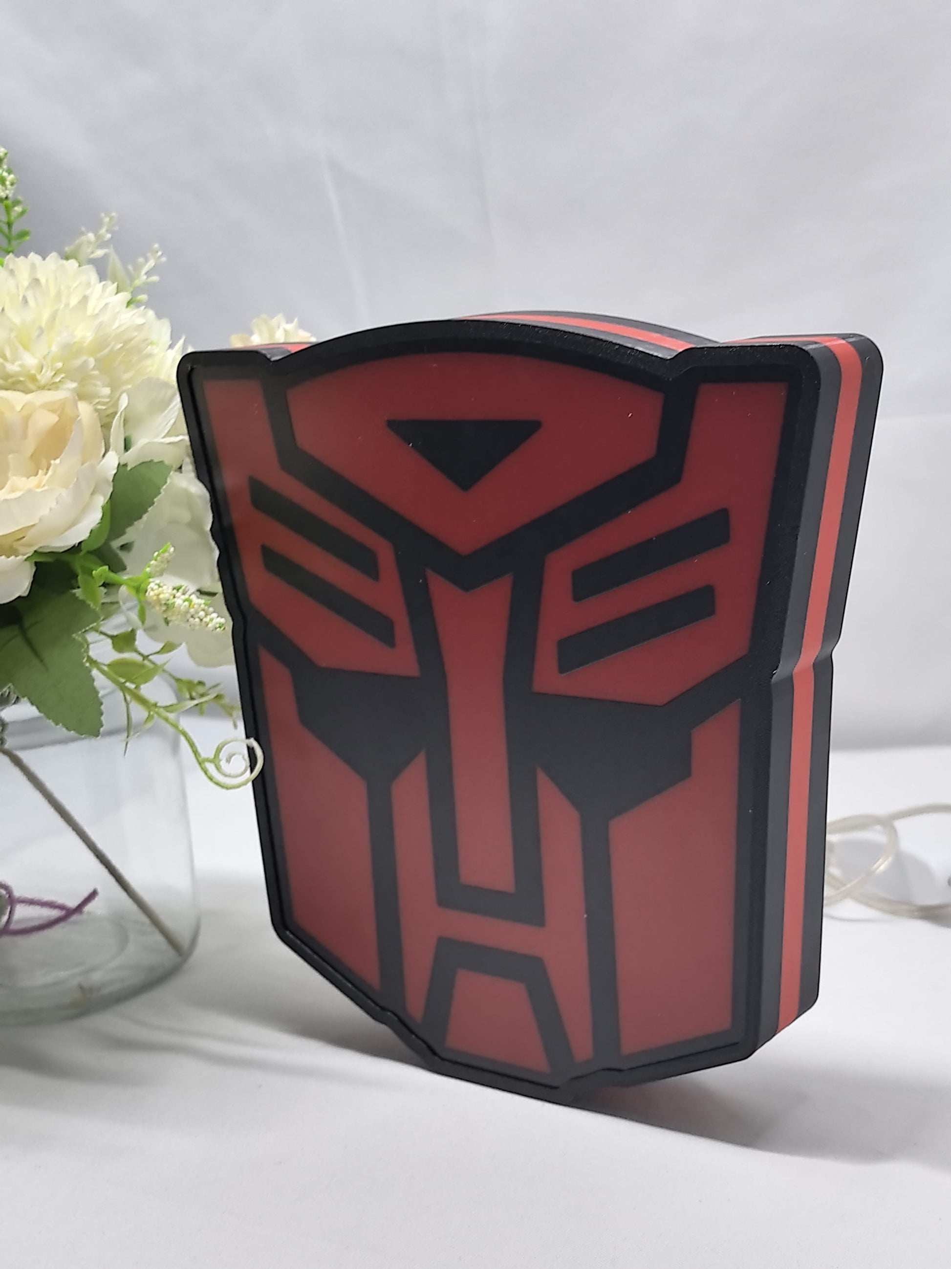Unlit angled details standing of Autobot Illuminated Sign in 20cm, perfect for garage and man cave decor