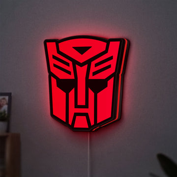 Autobot LED lightbox hanging on a wall with red glow