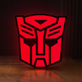 Front view of Autobot LED lightbox sign glowing on a wooden desk