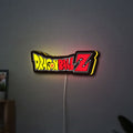 Dragon Ball Z LED lightbox hanging on a wall with yellow glow