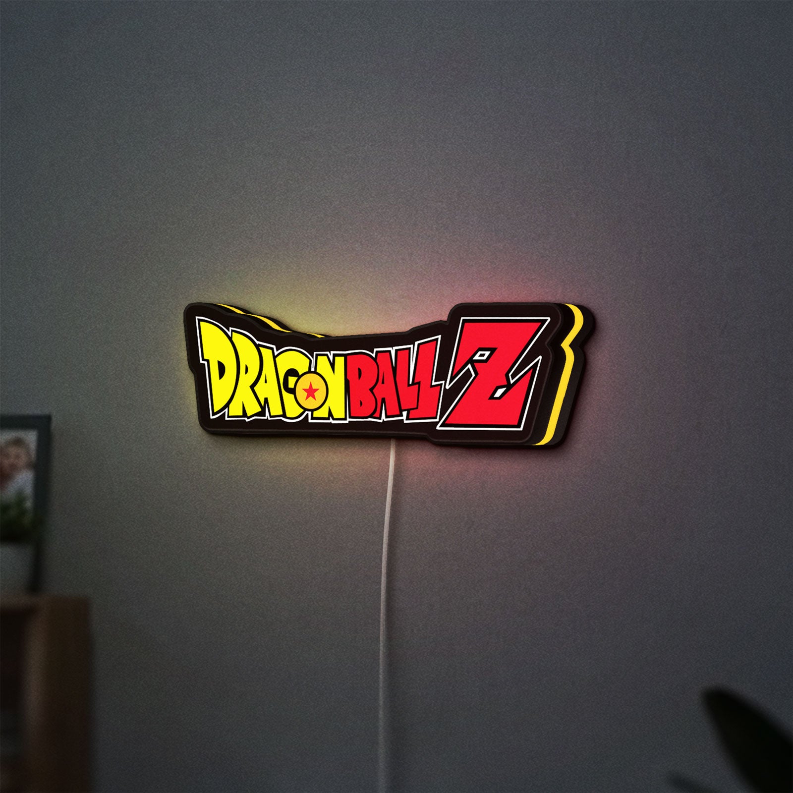 Dragon Ball Z LED lightbox hanging on a wall with yellow glow