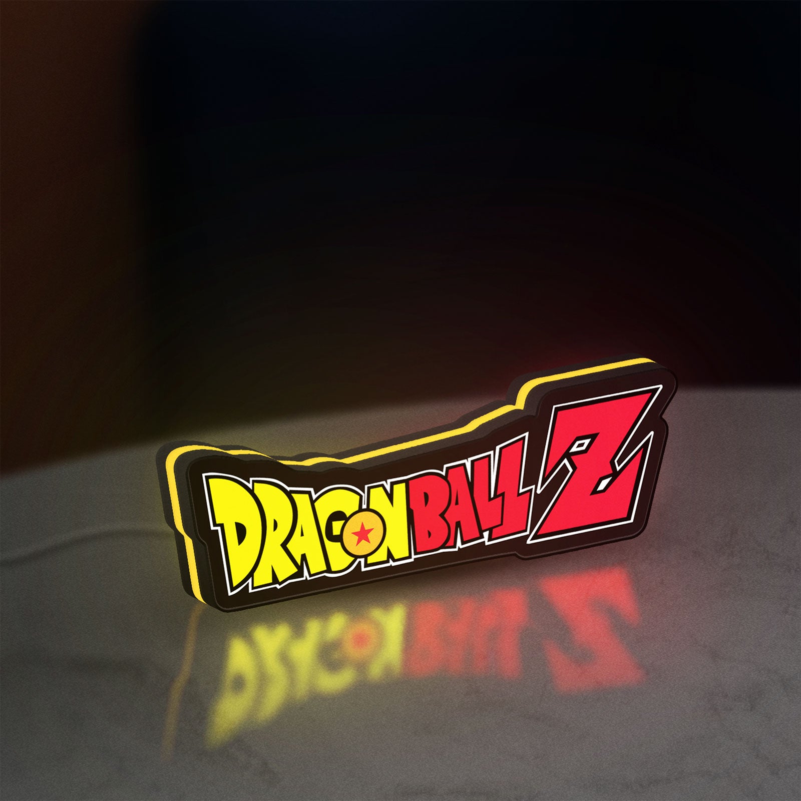 Dragon Ball Z LED lightbox standing on a desk from an angled side view with yellow glow