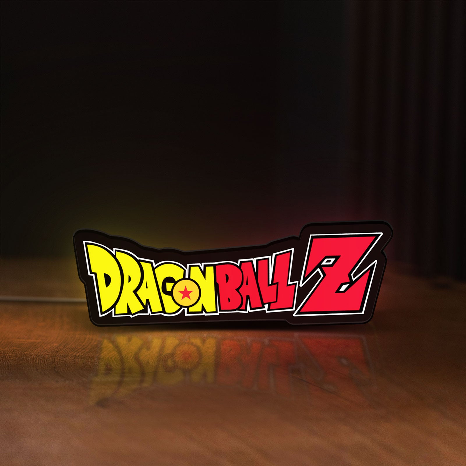 Front view of Dragon Ball Z LED lightbox sign glowing on a wooden desk
