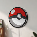 Unlit Pokeball LED lightbox mounted on a wall in daylight